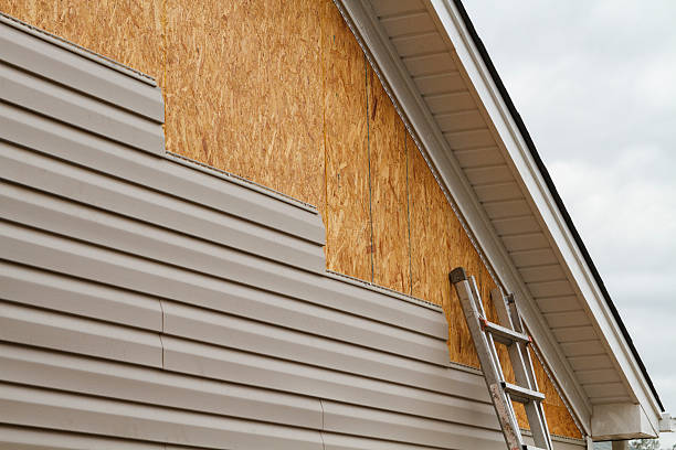 Professional Emergency Siding Repair technician working in Geneva, IN